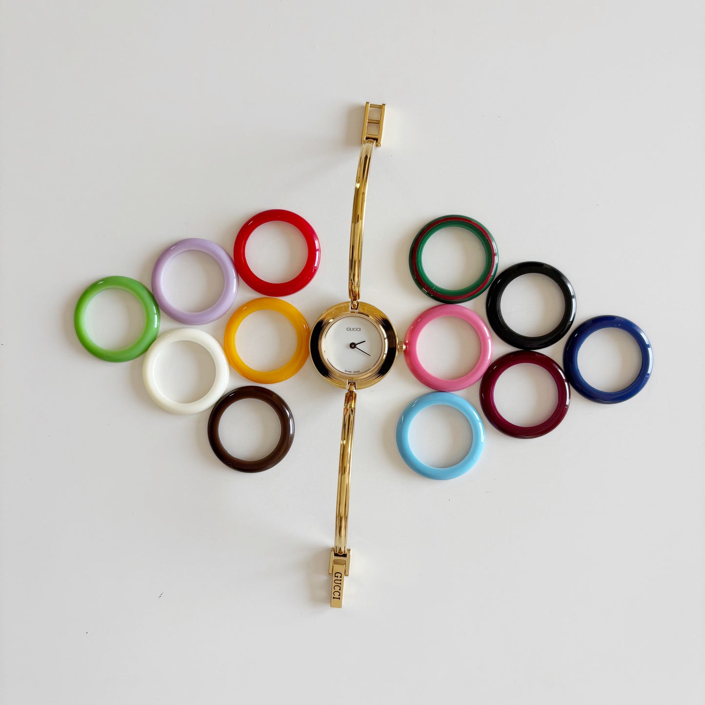 Gucci 1990s Interchangeable Bezel Gold Plated Bangle Watch with 12 bezels, case