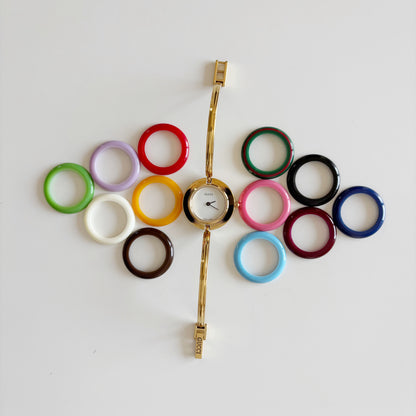 Gucci 1990s Interchangeable Bezel Gold Plated Bangle Watch with 12 bezels, case