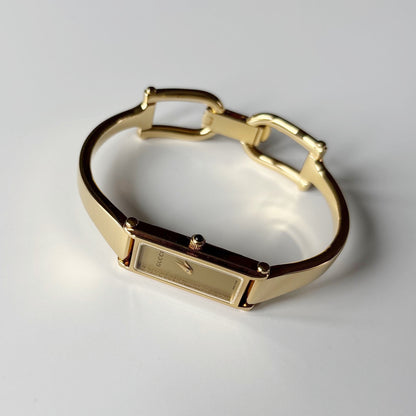Gucci 1990s Gold Rectangular Dial Gold Plated Bangle Watch