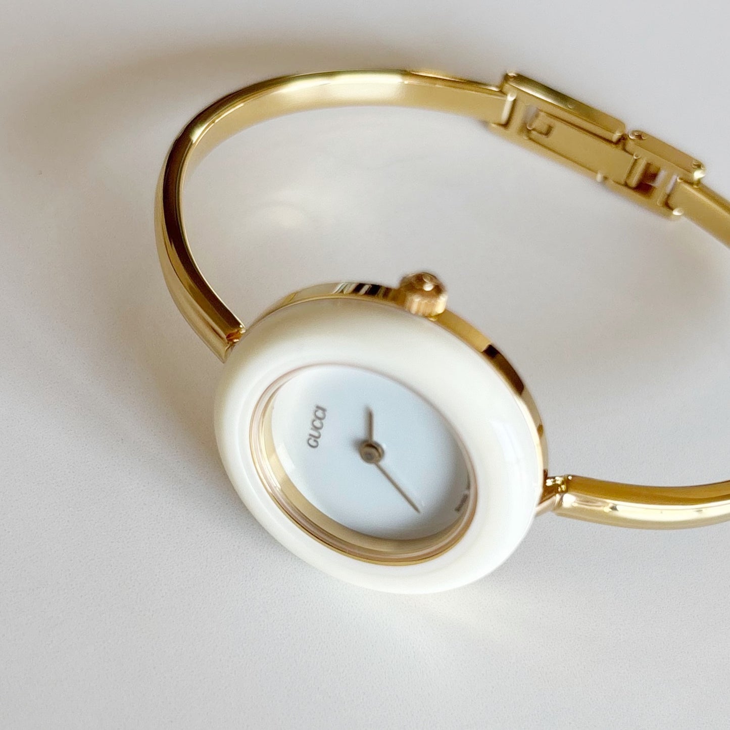 Gucci 1990s Interchangeable Bezel Gold Plated Bangle Watch with 12 bezels, case