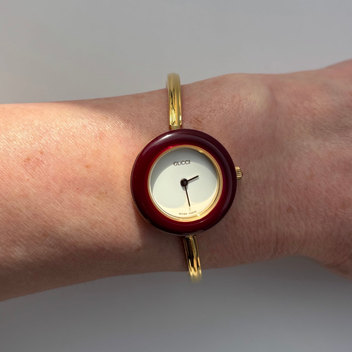 Gucci 1990s Interchangeable Bezel Gold Plated Bangle Watch with 12 bezels, case