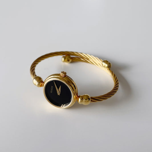 Gucci 1990s Black Dial Gold Plated Bangle Watch