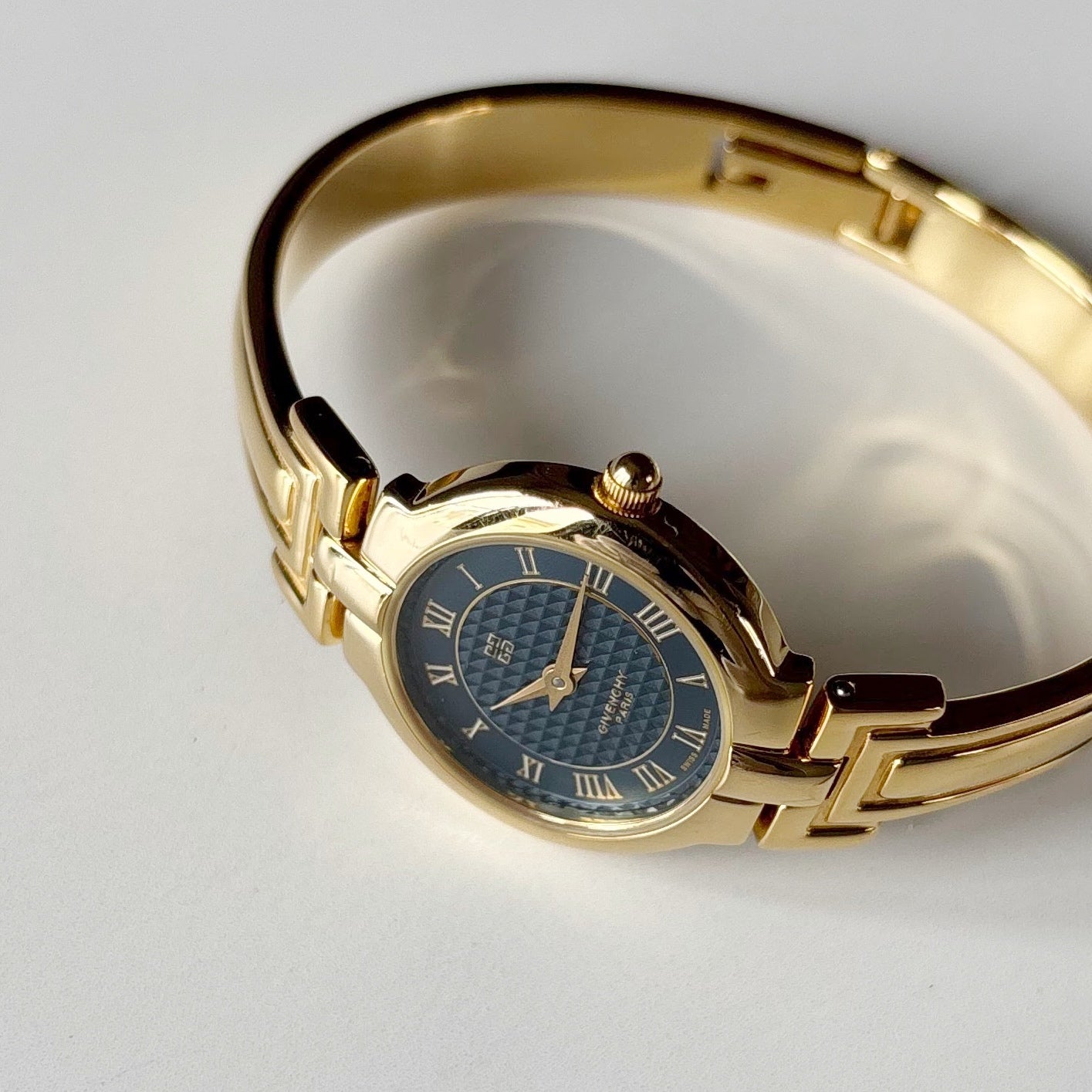 Givenchy 1990s Round Dial Gold Plated Bangle Watch
