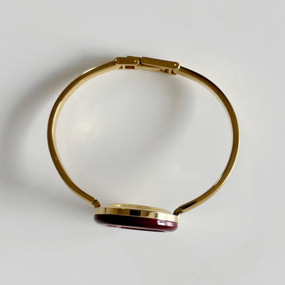Gucci 1990s Interchangeable Bezel Gold Plated Bangle Watch with 12 bezels, case