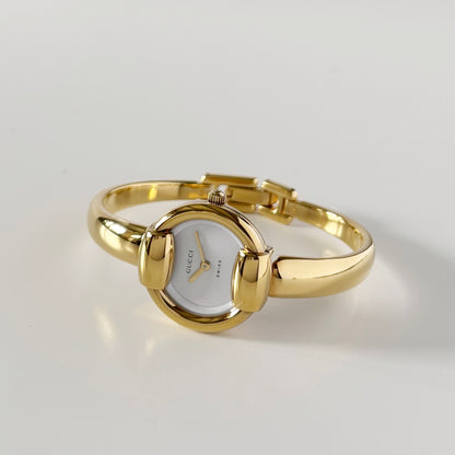 Gucci 1990s Round Dial Gold Plated Bangle Watch