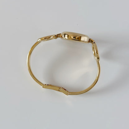 Gucci 1990s Seashell Oval Dial Gold-Plated Bangle Watch (Small)