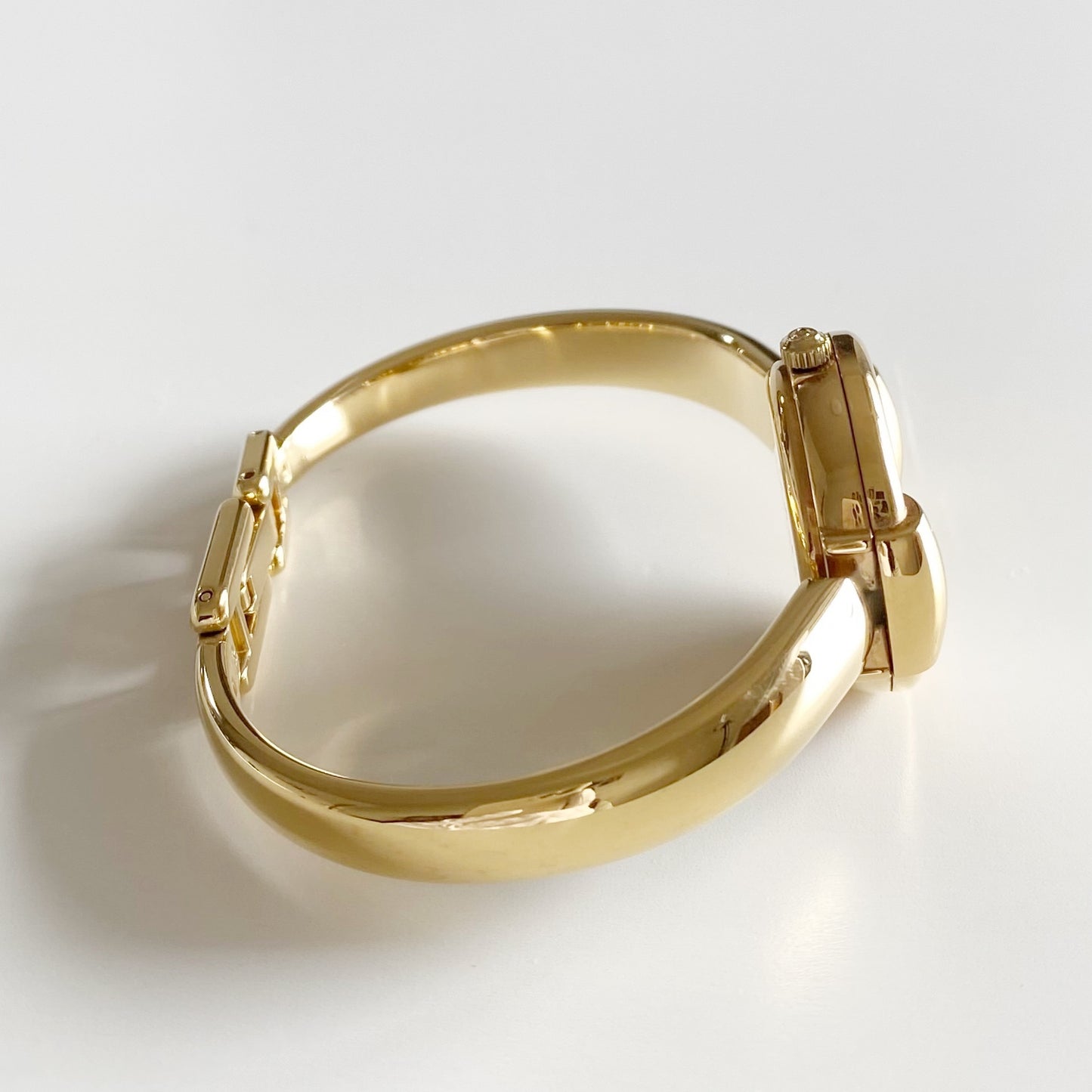 Gucci 1990s Round Dial Gold Plated Bangle Watch
