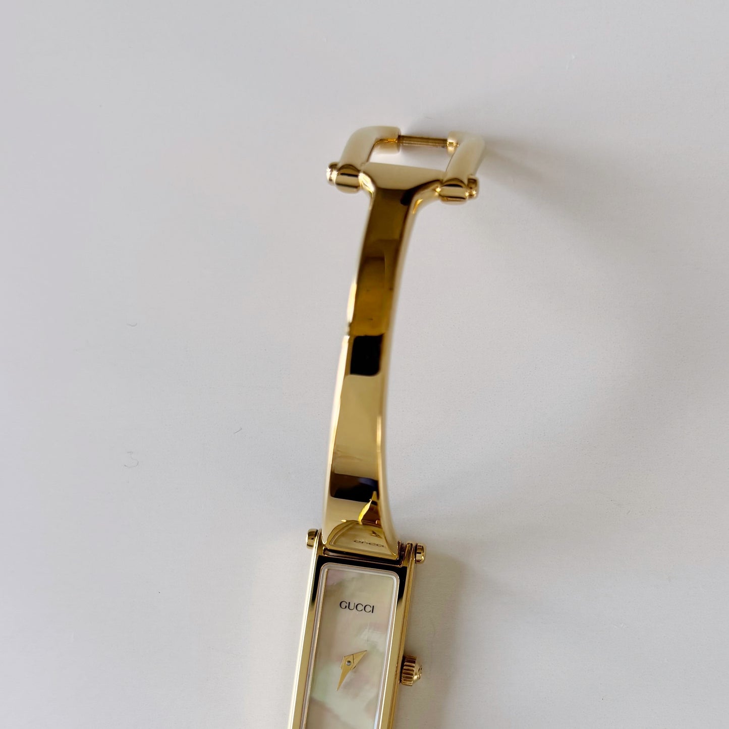 Gucci 1990s Seashell Rectangular Dial Gold Plated Bangle Watch