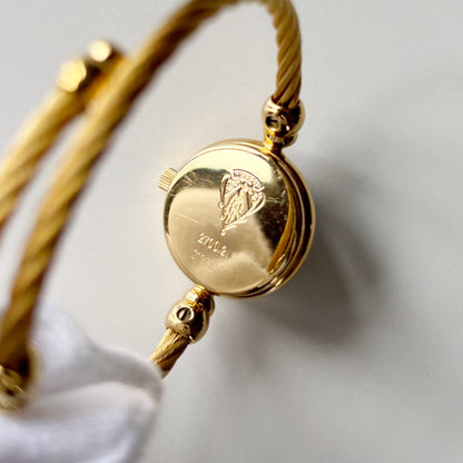 Gucci 1990s Black Round Dial Cable Gold Plated Bangle Watch