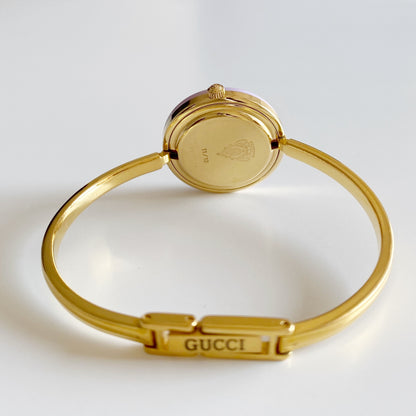 Gucci 1990s Interchangeable Bezel Gold Plated Bangle Watch with 12 bezels, case