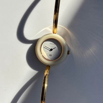 Gucci 1990s Interchangeable Bezel Gold Plated Bangle Watch with 12 bezels, case