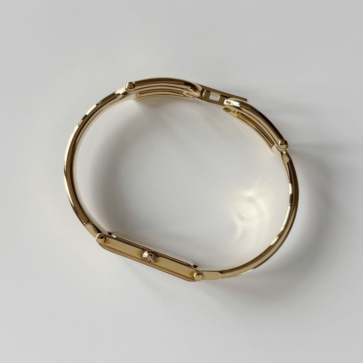 Gucci 1990s Gold Rectangular Dial Gold Plated Bangle Watch