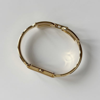 Gucci 1990s Gold Rectangular Dial Gold Plated Bangle Watch