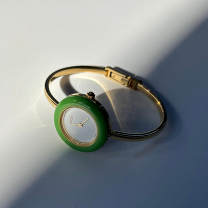 Gucci 1990s Interchangeable Bezel Gold Plated Bangle Watch with 12 bezels, case