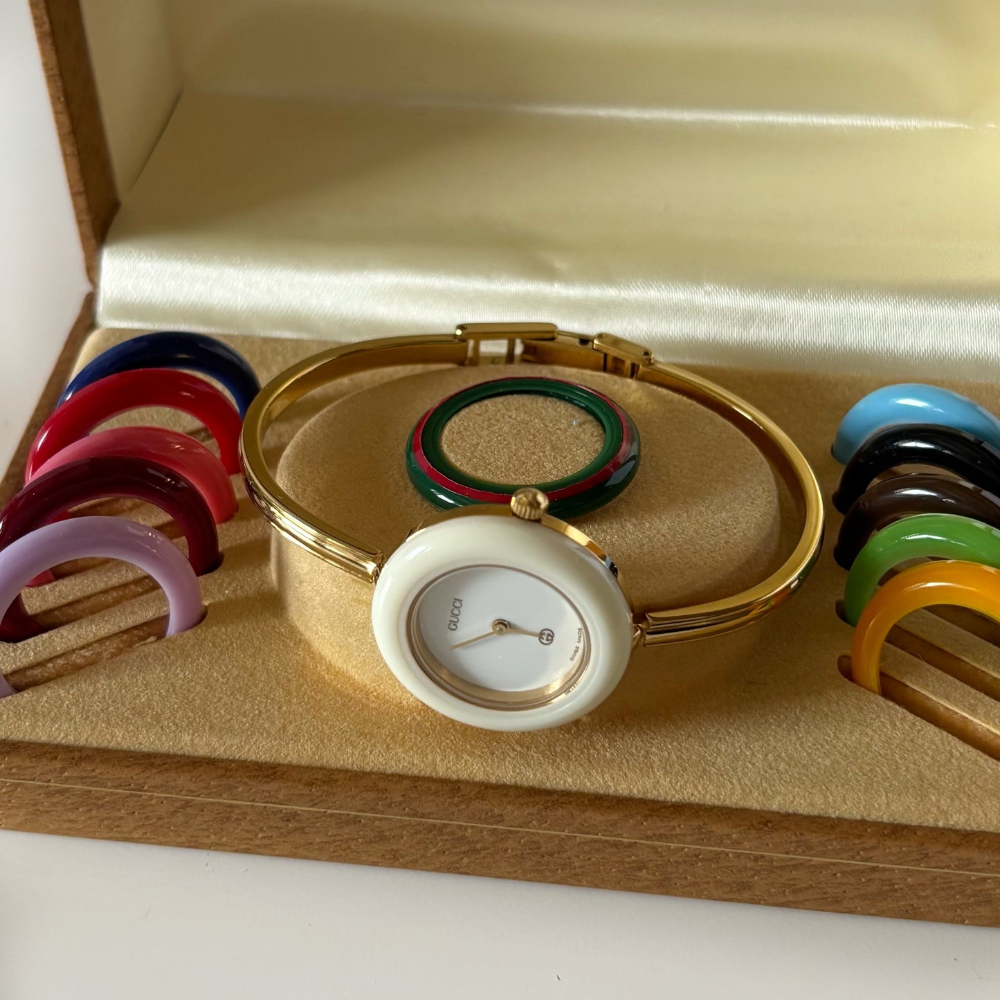 Gucci 1980s Interchangeable Bezel Gold Plated Bangle Watch with 12 bezels, case