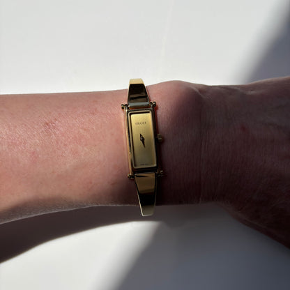 Gucci 1990s Rectangular Gold Dial Gold Plated Bangle Watch (Small)