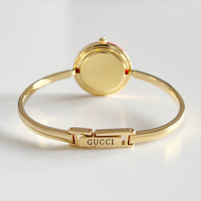 Gucci 1990s Interchangeable Bezel Gold Plated Bangle Watch with 12 bezels, case