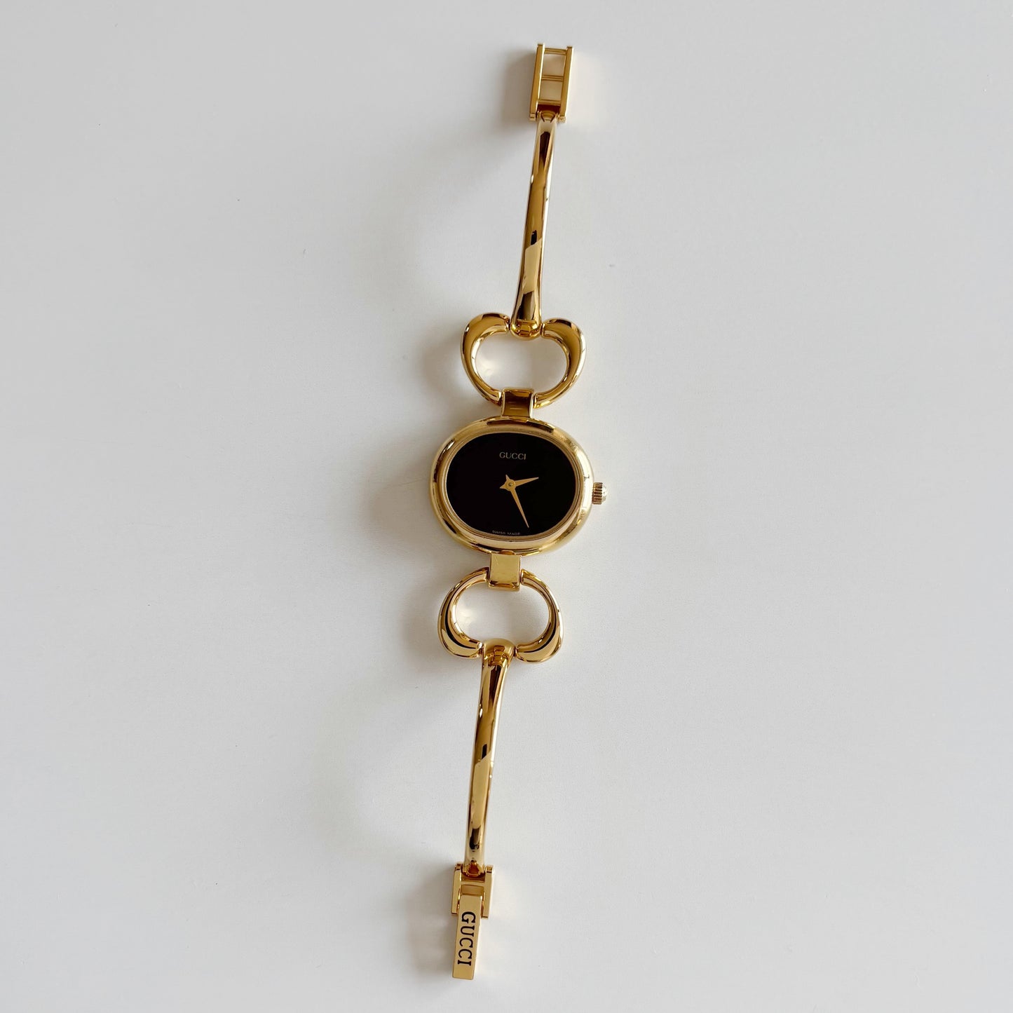 Gucci 1990s Oval Black Dial Gold Plated Bangle Watch (Small)