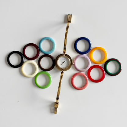 Gucci 1990s Interchangeable Bezel Gold Plated Bangle Watch with 12 bezels, case