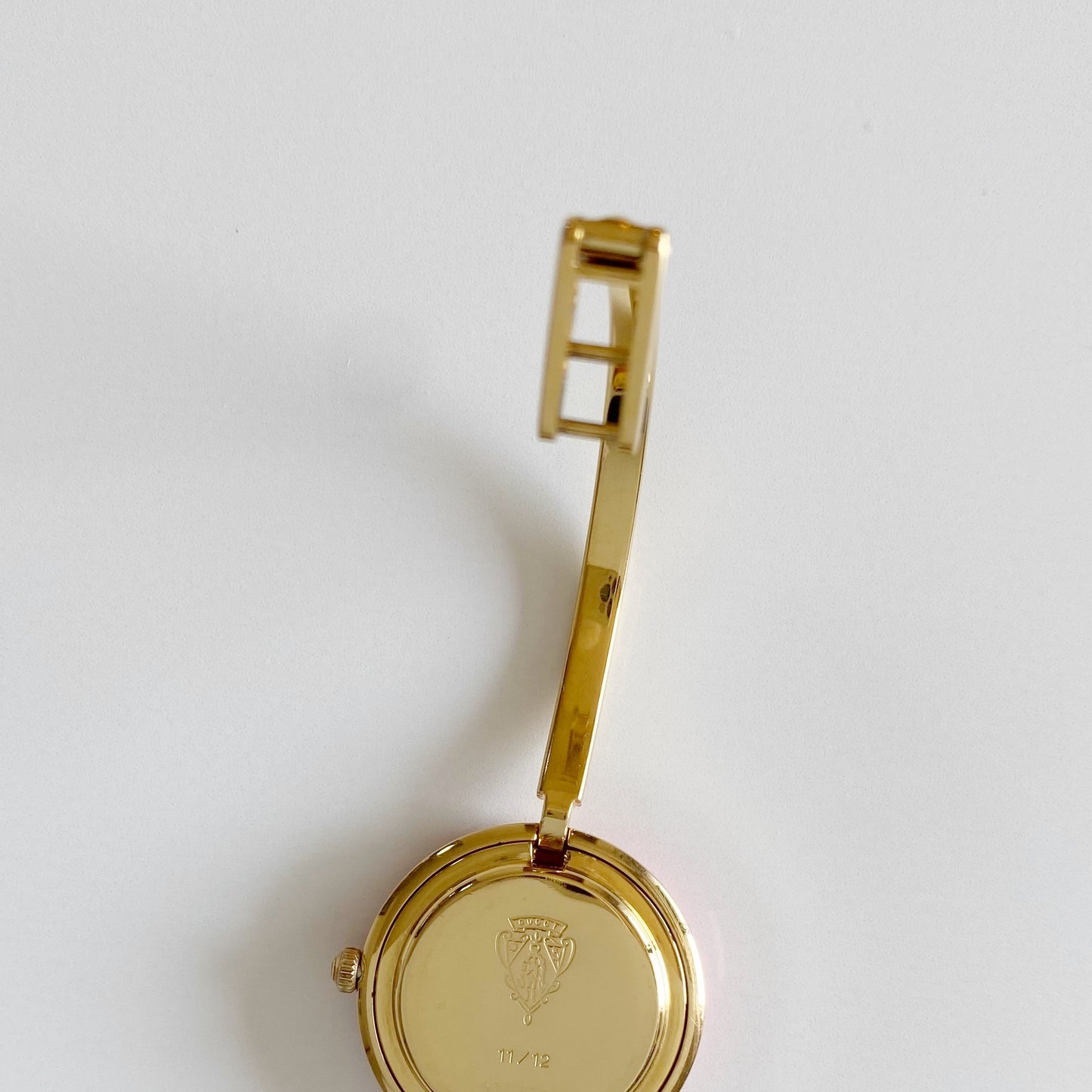 Gucci 1990s Interchangeable Bezel Gold Plated Bangle Watch with 12 bezels, case