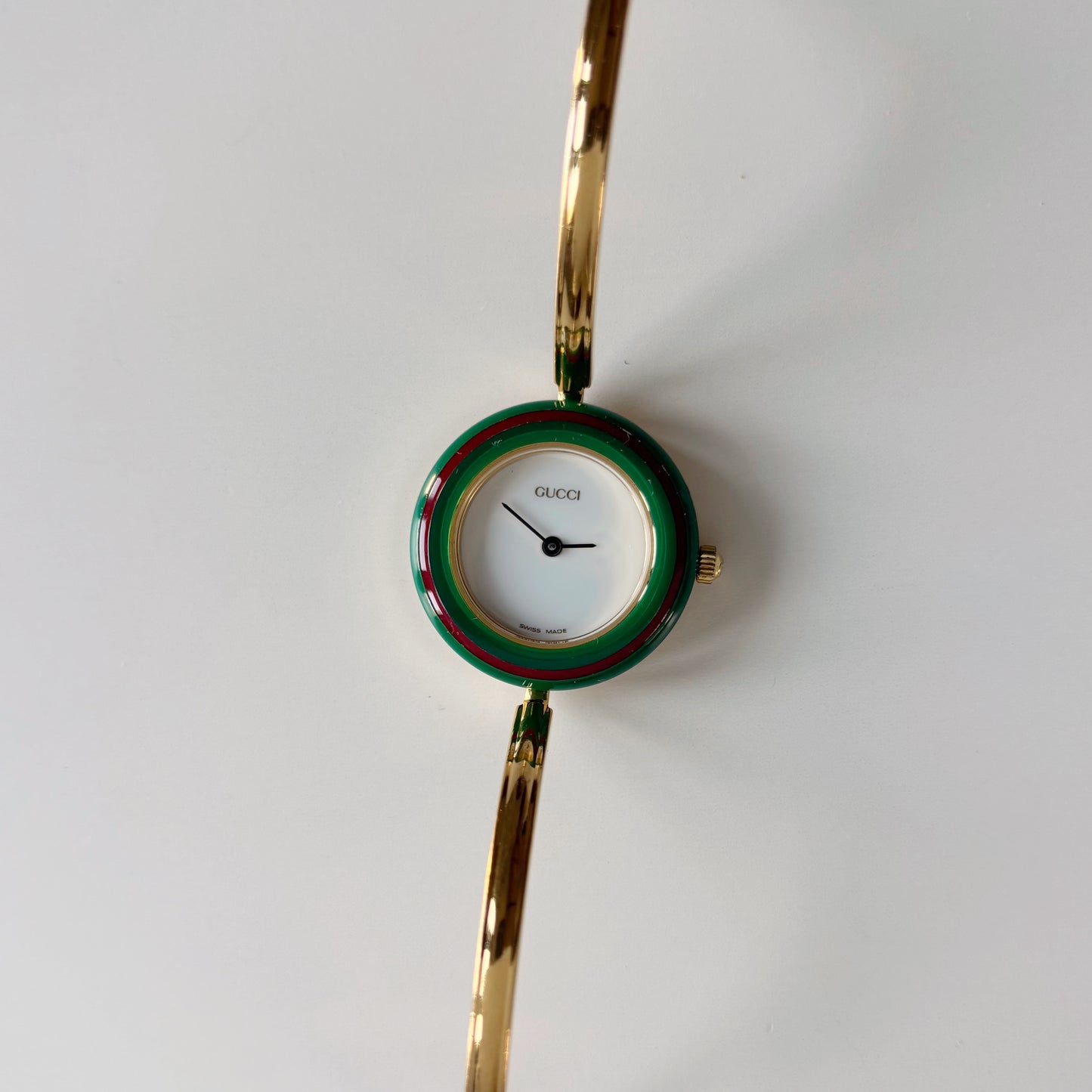 Gucci 1990s Interchangeable Bezel Gold Plated Bangle Watch with 12 bezels, case