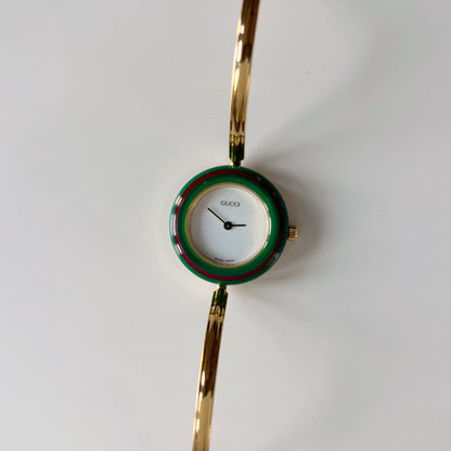 Gucci 1990s Interchangeable Bezel Gold Plated Bangle Watch with 12 bezels, case