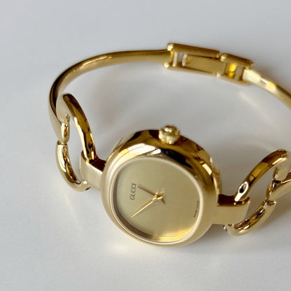 Gucci 1990s Oval Dial Gold Plated Bangle Watch