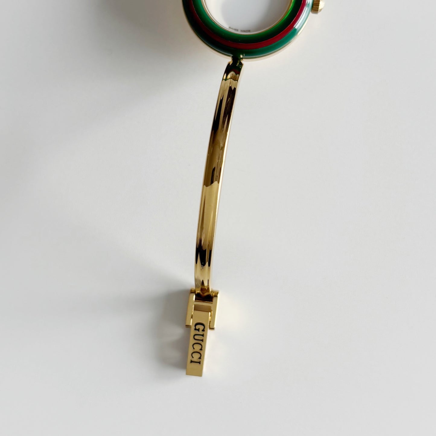 Gucci 1990s Interchangeable Bezel Gold Plated Bangle Watch with 12 bezels, case