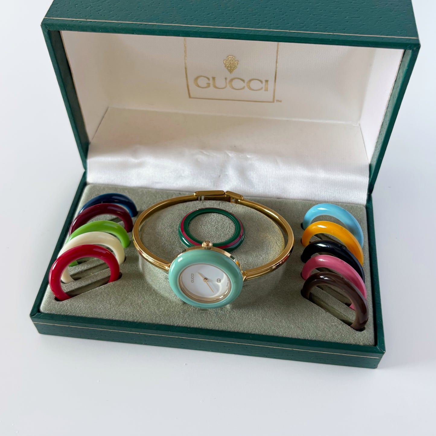 Gucci 1990s Interchangeable Bezel Gold Plated Bangle Watch with 12 bezels, case