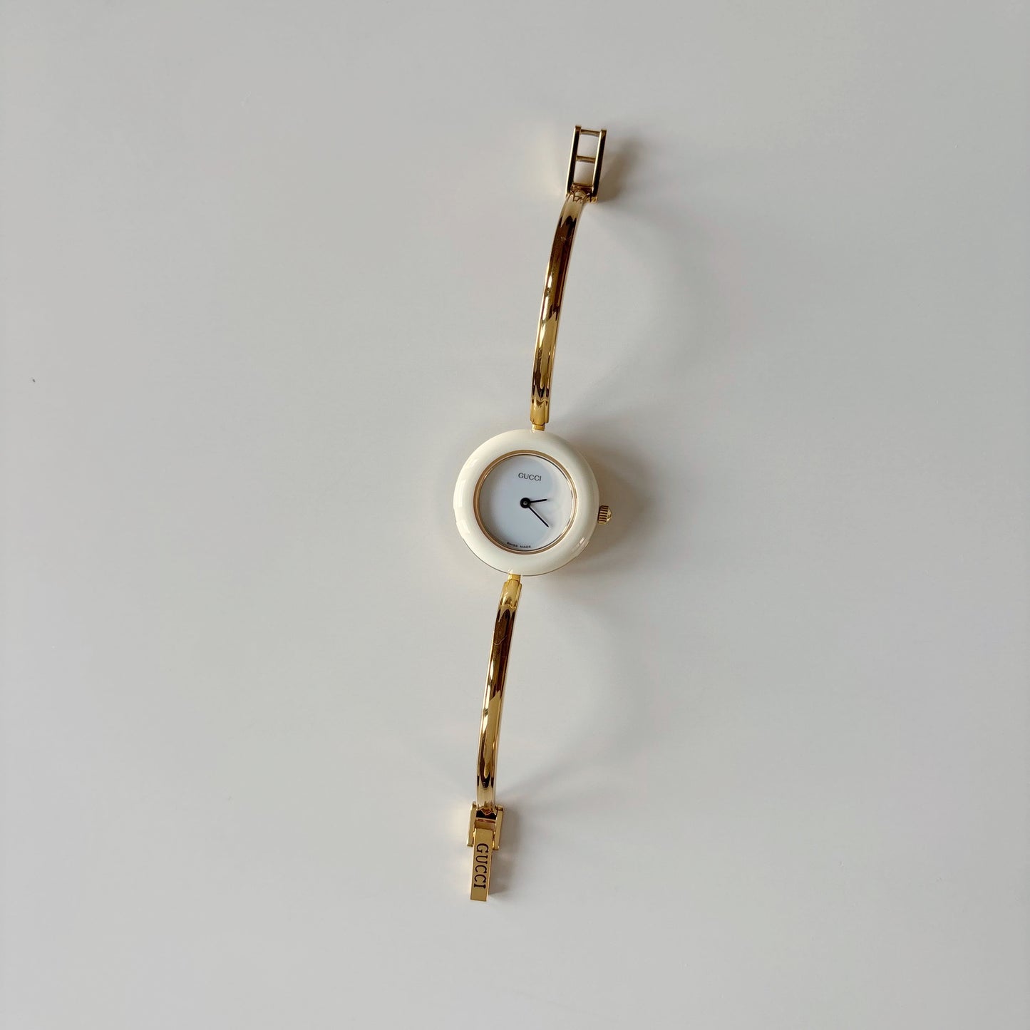 Gucci 1990s Interchangeable Bezel Gold Plated Bangle Watch with case, 12 bezels (Small)