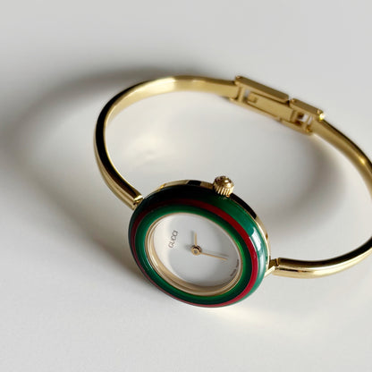 Gucci 1990s Interchangeable Bezel Gold Plated Bangle Watch with 12 bezels, case