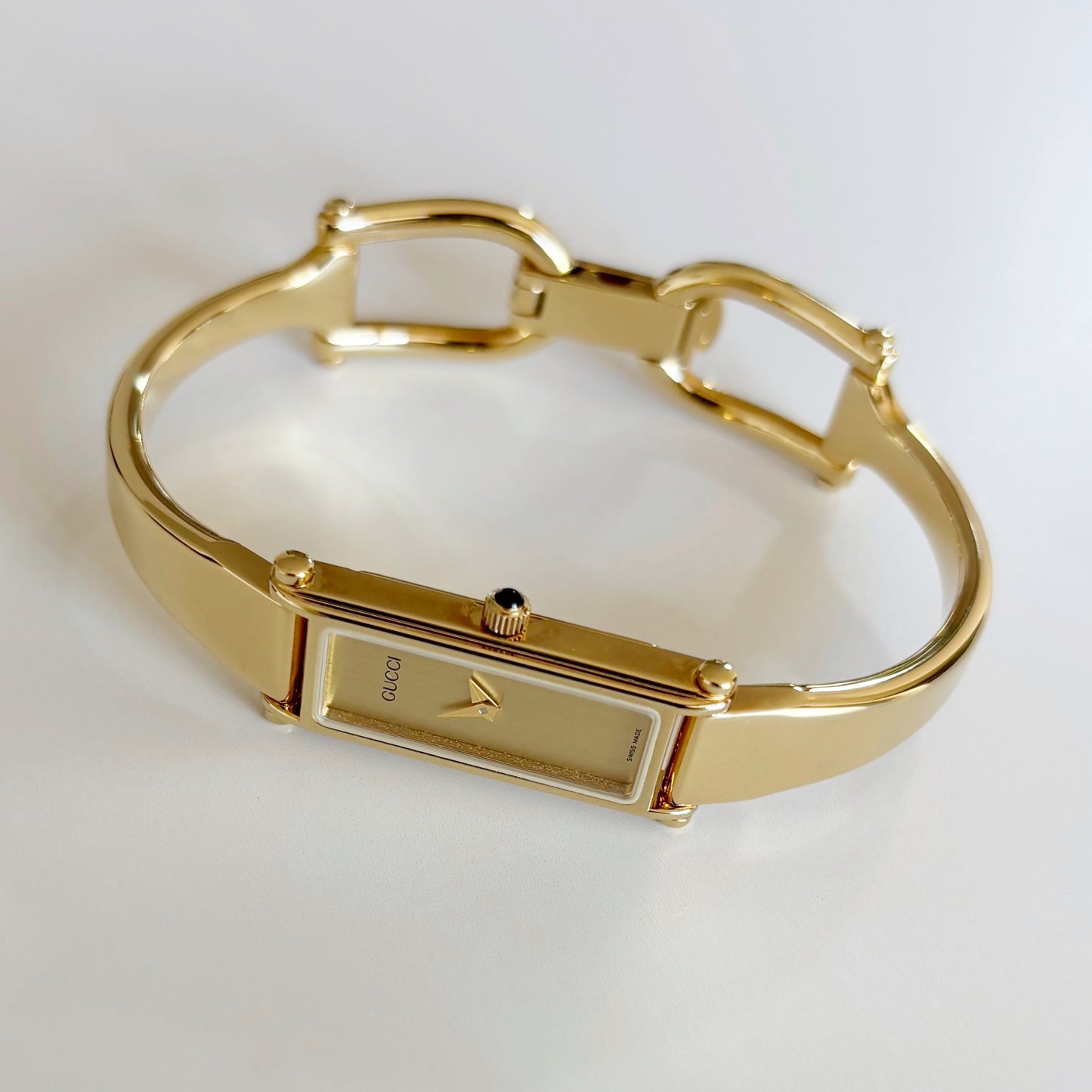 Gucci 1990s Rectangular Dial Gold Plated Bangle Watch