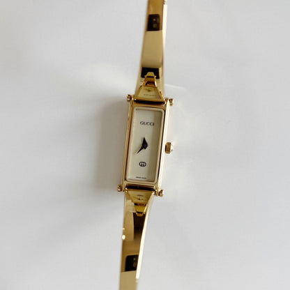 Gucci 1990s Cream Dial Rectangular Gold Plated Bangle Watch
