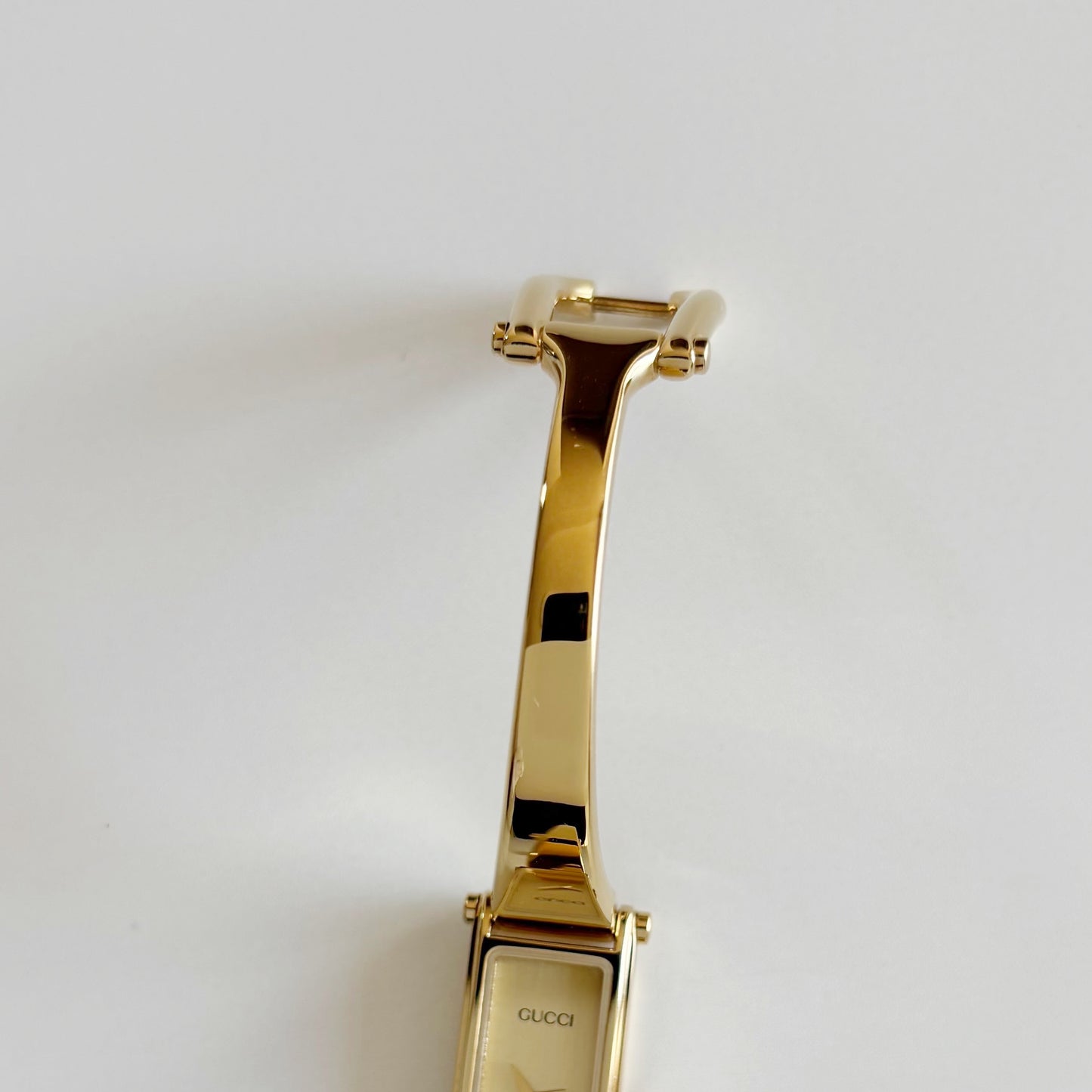 Gucci 1990s Rectangular Dial Gold Plated Bangle Watch