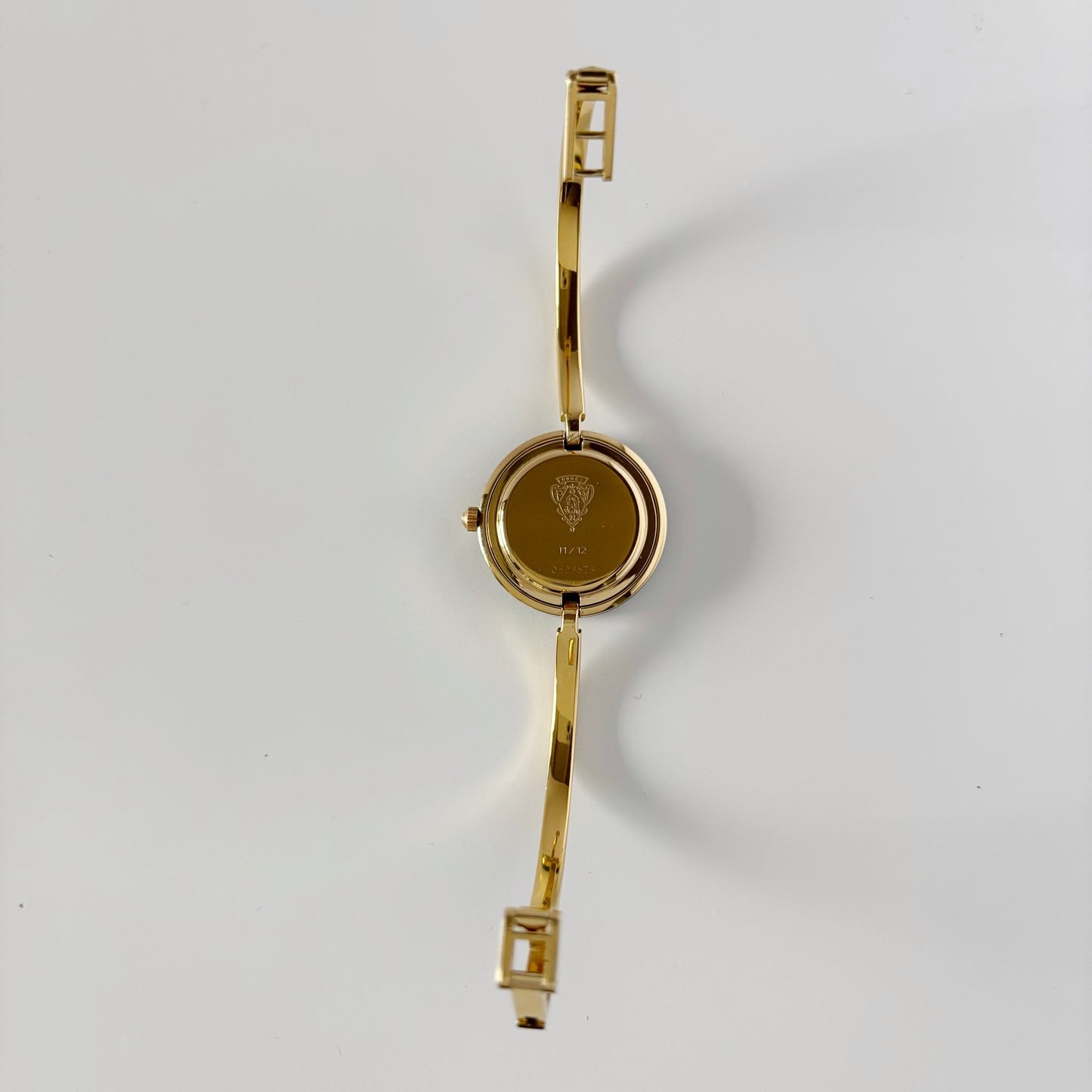 Gucci 1990s Interchangeable Bezel Gold Plated Bangle Watch with 12 bezels, case