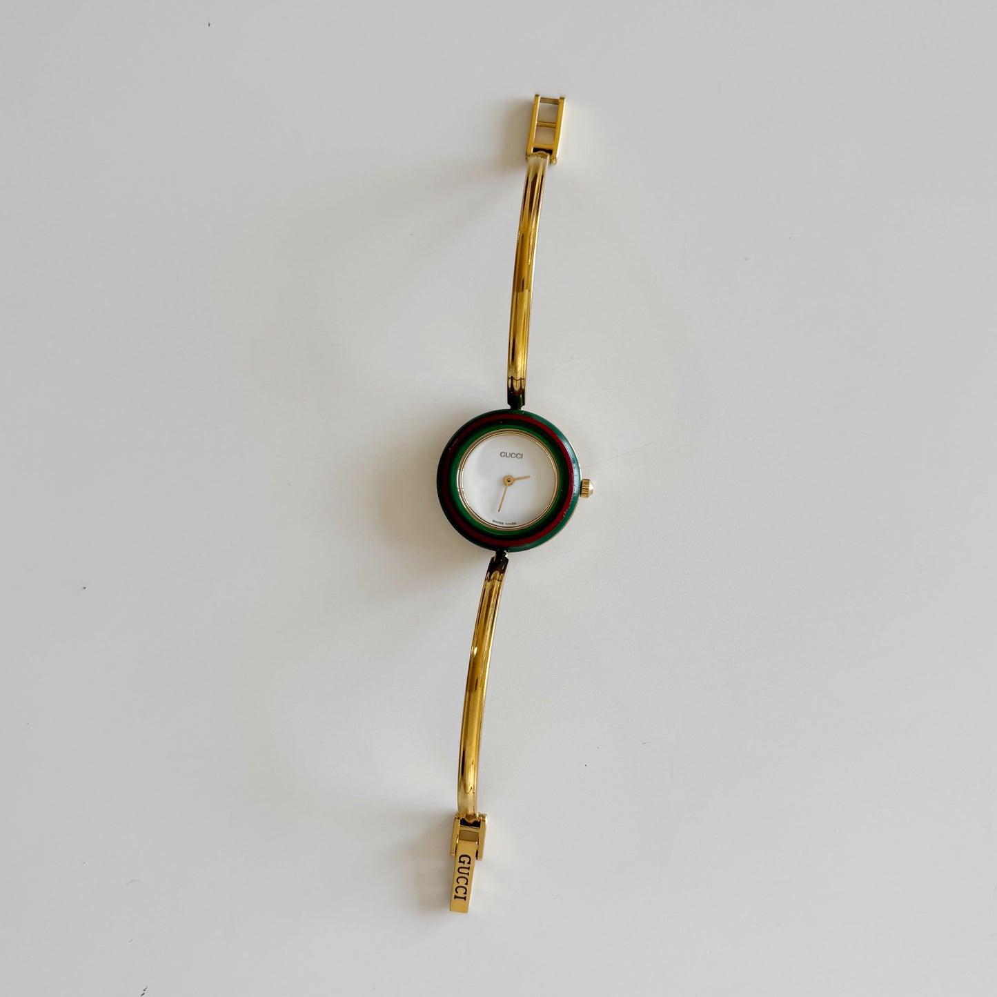 Gucci 1990s Interchangeable Bezel Gold Plated Bangle Watch with 12 bezels, case
