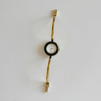 Gucci 1990s Interchangeable Bezel Gold Plated Bangle Watch with 12 bezels, case