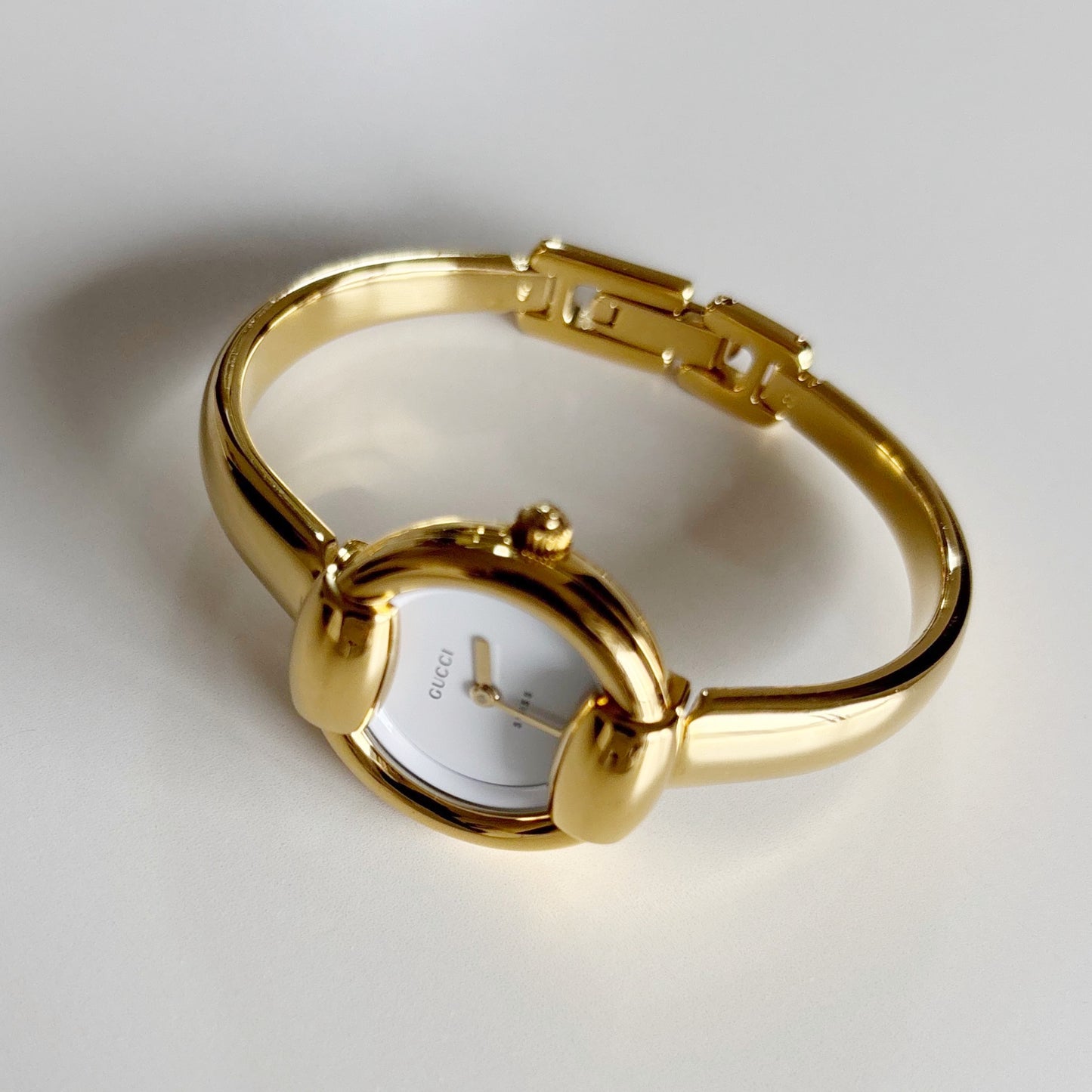 Gucci 1990s Round Dial Gold Plated Bangle Watch (Small)