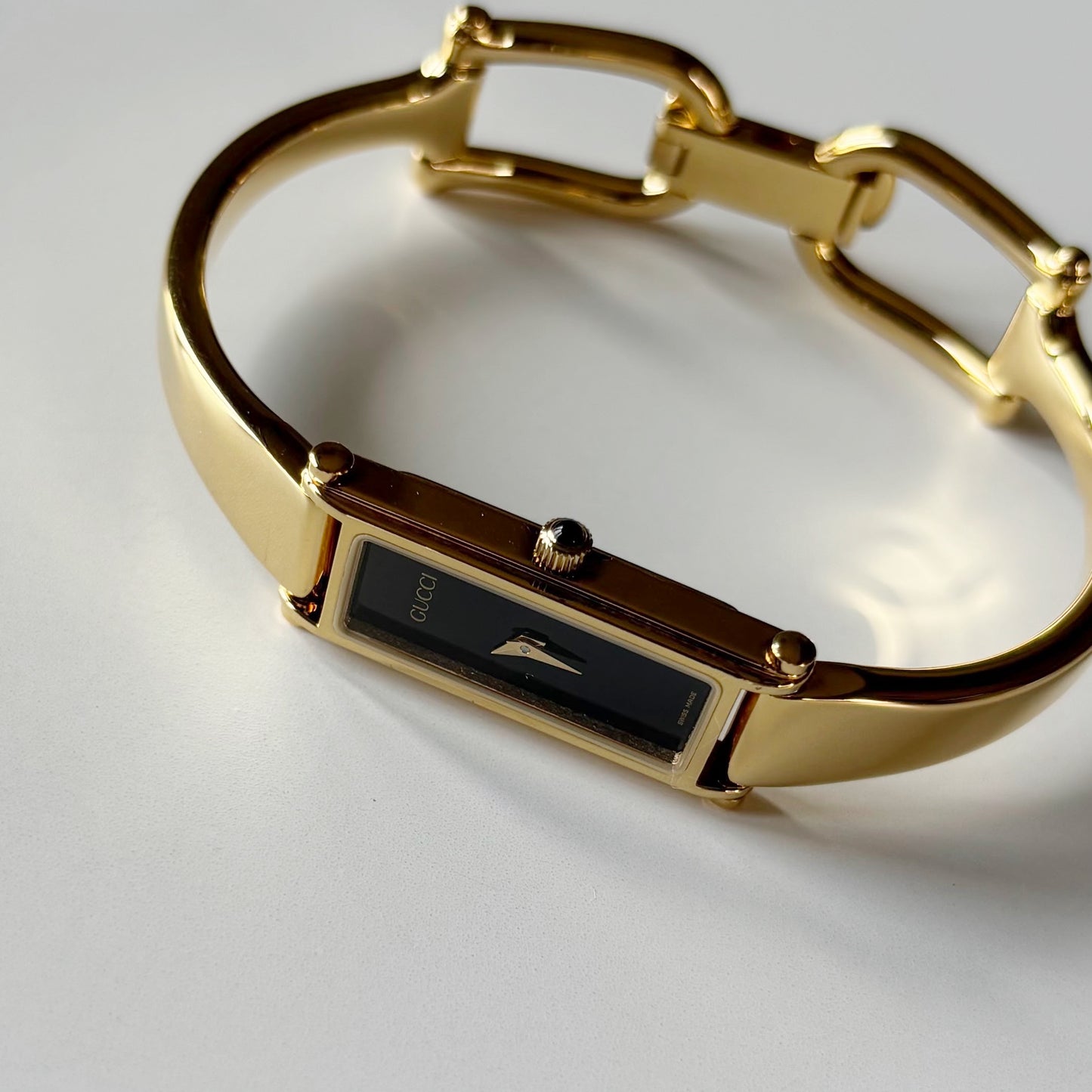 Gucci 1990s Black Rectangular Dial Gold Plated Bangle Watch