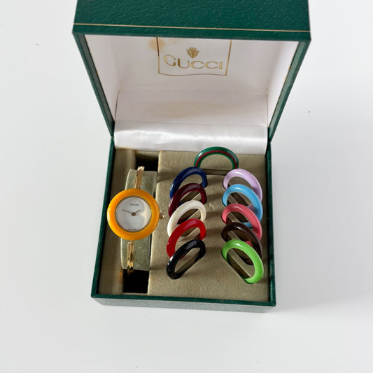 Gucci 1990s Interchangeable Bezel Gold Plated Bangle Watch with 12 bezels, case