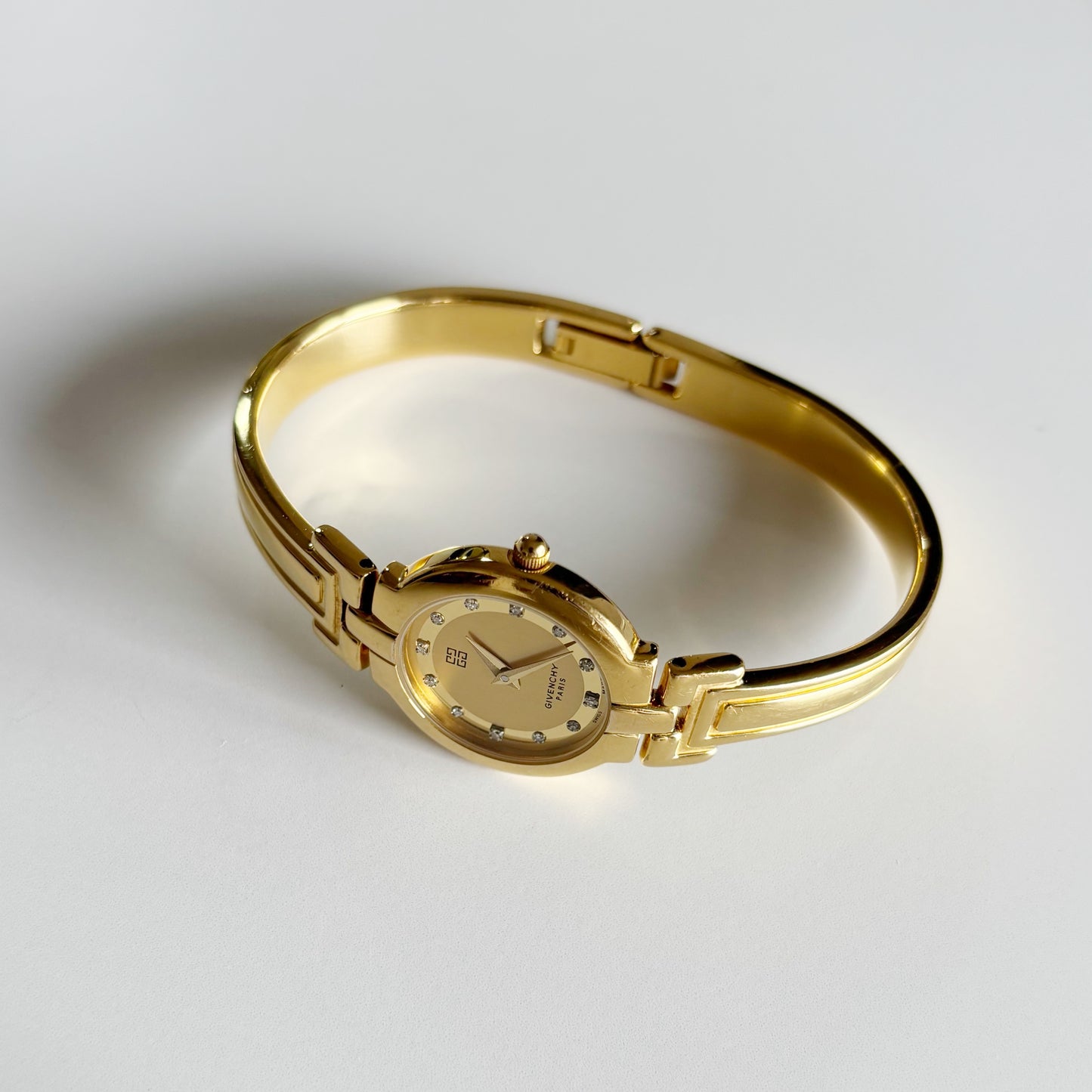 Givenchy 1990s Round Dial Gold Plated Bangle Watch