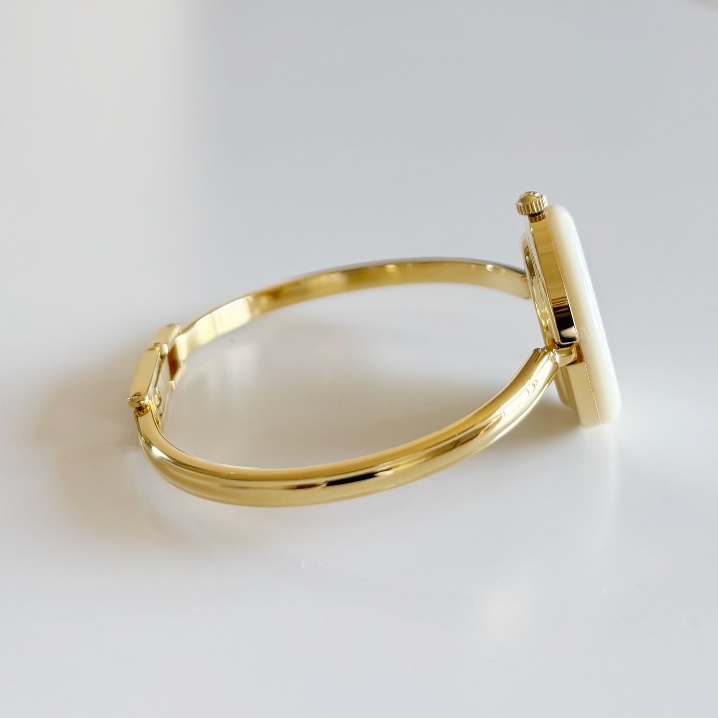 Gucci 1990s Interchangeable Bezel Gold Plated Bangle Watch with 12 bezels, case