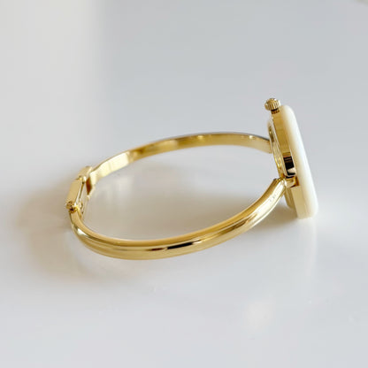 Gucci 1990s Interchangeable Bezel Gold Plated Bangle Watch with 12 bezels, case