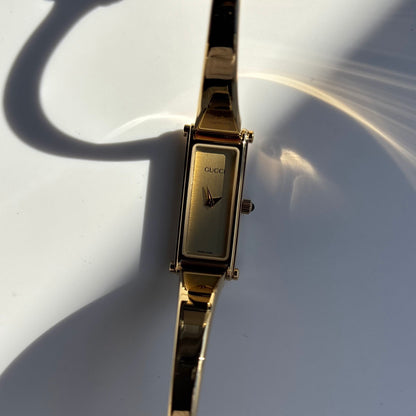 Gucci 1990s Rectangular Dial Gold Plated Bangle Watch