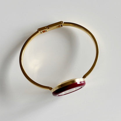 Gucci 1990s Interchangeable Bezel Gold Plated Bangle Watch with 12 bezels, case