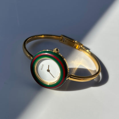 Gucci 1990s Interchangeable Bezel Gold Plated Bangle Watch with 12 bezels, case