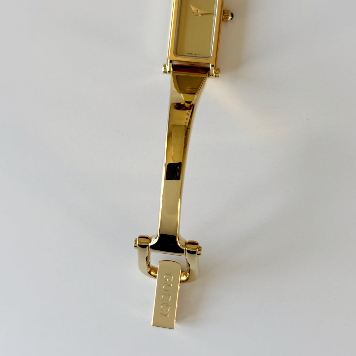 Gucci 1990s Rectangular Gold Dial Gold-Plated Watch