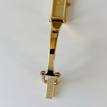 Gucci 1990s Rectangular Gold Dial Gold-Plated Watch