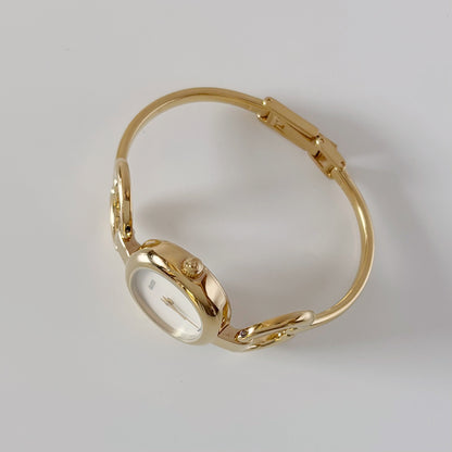 Gucci 1990s Seashell Oval Dial Gold-Plated Bangle Watch (Small)