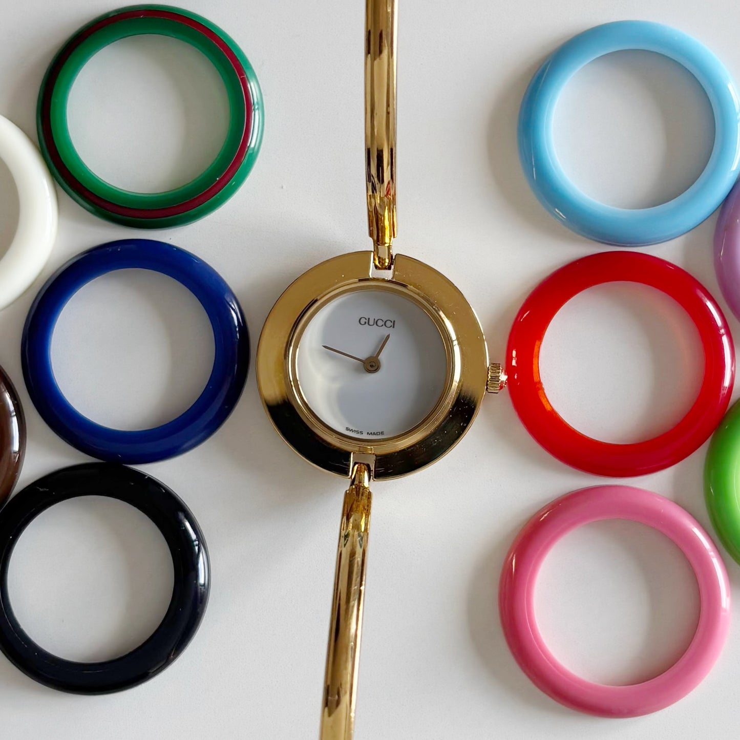 Gucci 1990s Interchangeable Bezel Gold Plated Bangle Watch with 12 bezels, case